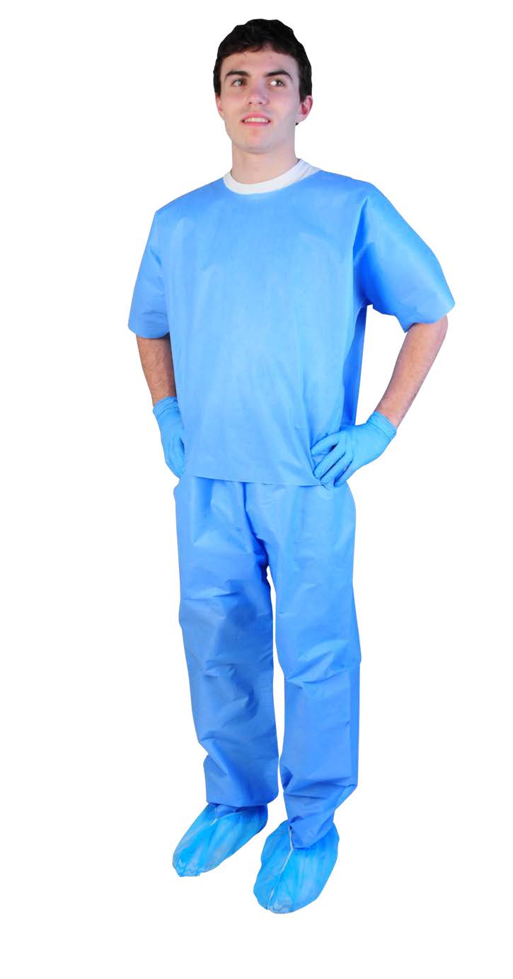 A person wearing disposable blue medical scrubs, gloves, and shoe covers, standing with hands on hips.